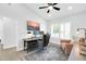 Stylish home office featuring modern desk setup, comfortable seating, and ample natural light for a productive workspace at 9739 E Pershing Ave, Scottsdale, AZ 85260