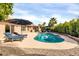 Backyard pool featuring lounge chairs, a clean pool deck, and lush landscaping for the perfect outdoor retreat at 9739 E Pershing Ave, Scottsdale, AZ 85260