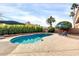 Private pool with a manicured yard, loungers, and shaded umbrellas, providing a serene and relaxing outdoor oasis at 9739 E Pershing Ave, Scottsdale, AZ 85260