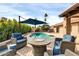 Inviting backyard with a sparkling pool, comfortable seating area, and mature landscaping for privacy and enjoyment at 9739 E Pershing Ave, Scottsdale, AZ 85260