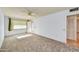 Comfortable carpeted bedroom featuring a window and closet space at 9813 W Pleasant Valley Rd, Sun City, AZ 85351