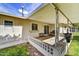 Spacious covered patio with a white brick railing provides a great area for outdoor living at 9813 W Pleasant Valley Rd, Sun City, AZ 85351