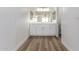 Bright bathroom features wood-look flooring, a modern vanity, and ample lighting at 1021 S Greenfield Rd # 1001, Mesa, AZ 85206