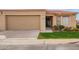 Charming single-story home featuring a tan garage door, a red tile roof, and a well-maintained front yard at 1021 S Greenfield Rd # 1001, Mesa, AZ 85206