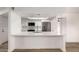 Bright kitchen featuring white cabinets, stainless steel appliances, quartz countertops, and modern finishes at 1021 S Greenfield Rd # 1001, Mesa, AZ 85206