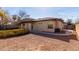 Spacious backyard with a covered patio, low-maintenance landscaping, and private setting at 1250 E Vermont Dr, Gilbert, AZ 85295