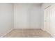 Empty bedroom features neutral carpet, blank walls, and a closet door at 1250 E Vermont Dr, Gilbert, AZ 85295