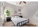 Bright bedroom featuring a minimalist design, black metal bed frame, and natural lighting at 1250 E Vermont Dr, Gilbert, AZ 85295