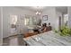 The dining area features a modern chandelier and natural light streaming through the window at 1250 E Vermont Dr, Gilbert, AZ 85295