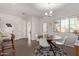 Cozy dining area adjacent to the kitchen, featuring a modern chandelier and natural light at 1250 E Vermont Dr, Gilbert, AZ 85295