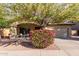 Charming single-story home featuring a desert landscape and mature trees in a well-maintained neighborhood at 1250 E Vermont Dr, Gilbert, AZ 85295