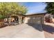 Lovely one-story home featuring a desert landscape, an attached two-car garage, and a concrete driveway at 1250 E Vermont Dr, Gilbert, AZ 85295