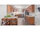 Open kitchen with breakfast bar, stainless appliances, and generous countertop space for cooking at 1250 E Vermont Dr, Gilbert, AZ 85295