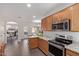 Bright kitchen area with stainless appliances, granite countertops, and eat in dining area at 1250 E Vermont Dr, Gilbert, AZ 85295