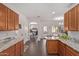 Spacious kitchen featuring granite countertops, wood cabinetry, and an open layout at 1250 E Vermont Dr, Gilbert, AZ 85295