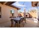 Outdoor patio with large table, seating, and string lights, great for entertaining at 1250 E Vermont Dr, Gilbert, AZ 85295
