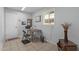 This home office has tile floors, a convenient desk and chair, and plenty of natural light at 12633 W Brandywine Dr, Sun City West, AZ 85375