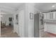 Well-equipped kitchen with updated appliances, white cabinetry, and convenient access to the dining area at 12633 W Brandywine Dr, Sun City West, AZ 85375