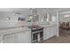 Stylish kitchen featuring granite countertops, stainless steel oven, and a view to the breakfast bar at 12633 W Brandywine Dr, Sun City West, AZ 85375