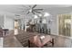 Spacious living area with an open layout, barstool seating, and a seamless transition to the kitchen at 12633 W Brandywine Dr, Sun City West, AZ 85375