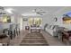 Inviting living room with hardwood floors, a cozy rug, and stylish furnishings, perfect for relaxation at 12633 W Brandywine Dr, Sun City West, AZ 85375
