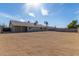 Back exterior view of home with spacious backyard at 1318 E Mission Grande Ave, Casa Grande, AZ 85122