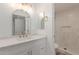 This bathroom has a quartz countertop and a decorative mirror at 1318 E Mission Grande Ave, Casa Grande, AZ 85122