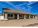 Well-maintained single-story home with desert landscaping, a tiled roof, and an attached two-car garage at 1318 E Mission Grande Ave, Casa Grande, AZ 85122