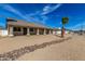 Well-maintained single-story home with desert landscaping, a tiled roof, and an attached two-car garage at 1318 E Mission Grande Ave, Casa Grande, AZ 85122