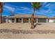 Charming single-story home featuring a desert landscaped yard with a neutral-colored facade and attached garage at 1318 E Mission Grande Ave, Casa Grande, AZ 85122