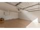 This is an empty garage with built-in shelving along the wall at 1318 E Mission Grande Ave, Casa Grande, AZ 85122