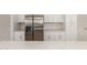 Close-up of a stainless steel refrigerator surrounded by white cabinets and countertops at 1318 E Mission Grande Ave, Casa Grande, AZ 85122