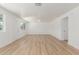 Bright living room with neutral walls, wood-look floors, a ceiling fan, and ample natural light at 1318 E Mission Grande Ave, Casa Grande, AZ 85122