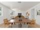 Bright living room with furniture, wood-look floors, a ceiling fan, and ample natural light at 1318 E Mission Grande Ave, Casa Grande, AZ 85122