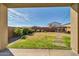 The spacious backyard offers a gazebo, stepping stones, well maintained lawn and string lights at 13307 W Paso Trl, Peoria, AZ 85383
