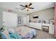 Cozy bedroom showcases a fun, youthful design with a decorative wall and ample storage space at 13307 W Paso Trl, Peoria, AZ 85383