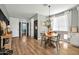 Charming dining area with a round table, wood floors, and bright natural light at 13307 W Paso Trl, Peoria, AZ 85383