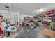 Spacious garage featuring an off-road vehicle and ample storage shelving at 13307 W Paso Trl, Peoria, AZ 85383