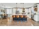 Open kitchen layout with a large island, white cabinets, stainless steel appliances, and an adjacent dining area at 13307 W Paso Trl, Peoria, AZ 85383