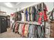 Organized walk-in closet features ample hanging space, shelving, and a secure safe for valuables at 13307 W Paso Trl, Peoria, AZ 85383