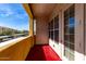 View of the balcony, showcasing the outdoor space, with views of the community and sky beyond at 14575 W Mountain View Blvd # 11221, Surprise, AZ 85374