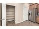 Spacious kitchen offers stainless appliances, wood cabinets, granite countertops and large pantry for storage at 14575 W Mountain View Blvd # 11221, Surprise, AZ 85374