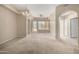 Living space with access to an outdoor balcony, fan, and light-colored walls to create a relaxing atmosphere at 14575 W Mountain View Blvd # 11221, Surprise, AZ 85374
