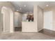 Open-concept living space leading into the kitchen, creating an airy and interactive layout for modern living at 14575 W Mountain View Blvd # 11221, Surprise, AZ 85374
