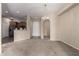 Open-concept living area with views of the kitchen, providing a spacious and airy feel to the home at 14575 W Mountain View Blvd # 11221, Surprise, AZ 85374