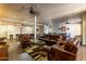 The community lounge has leather couches, billiards, and a dining space for residents' use at 14575 W Mountain View Blvd # 11221, Surprise, AZ 85374