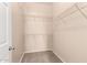 Walk-in closet featuring carpet and wire shelving for clothing and storage at 14575 W Mountain View Blvd # 11221, Surprise, AZ 85374