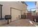 Backyard features a grill, tiled patio, and a decorative flower arrangement at 1531 S Owl Dr, Gilbert, AZ 85296
