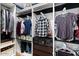 Organized walk-in closet with custom shelving, hanging rods, and drawers for optimal storage at 1531 S Owl Dr, Gilbert, AZ 85296