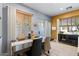 Bright dining area with dark table and wooden blinds, with natural light at 1531 S Owl Dr, Gilbert, AZ 85296